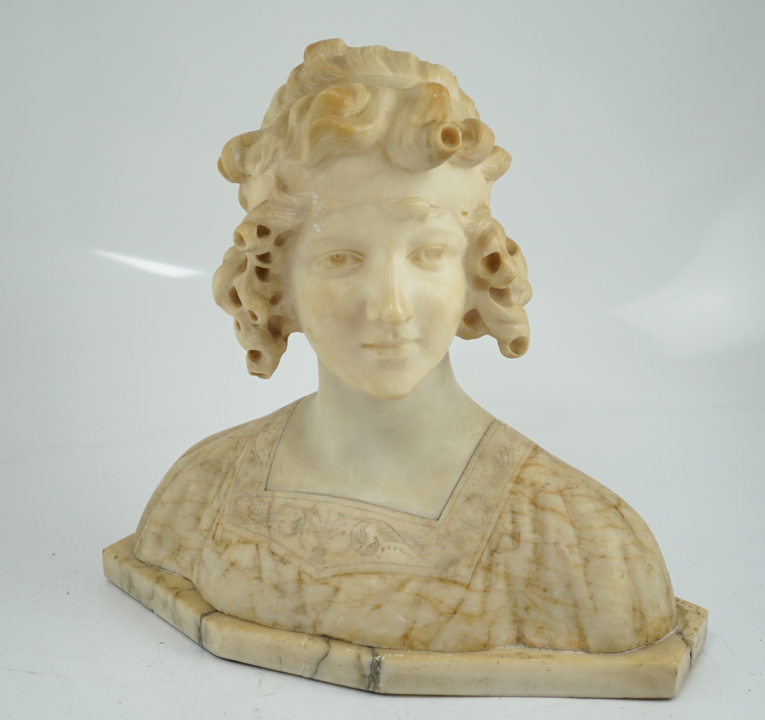 Magison Bland, an Art Nouveau alabaster head and shoulder study of a young beauty, 39cm wide, 36cm high